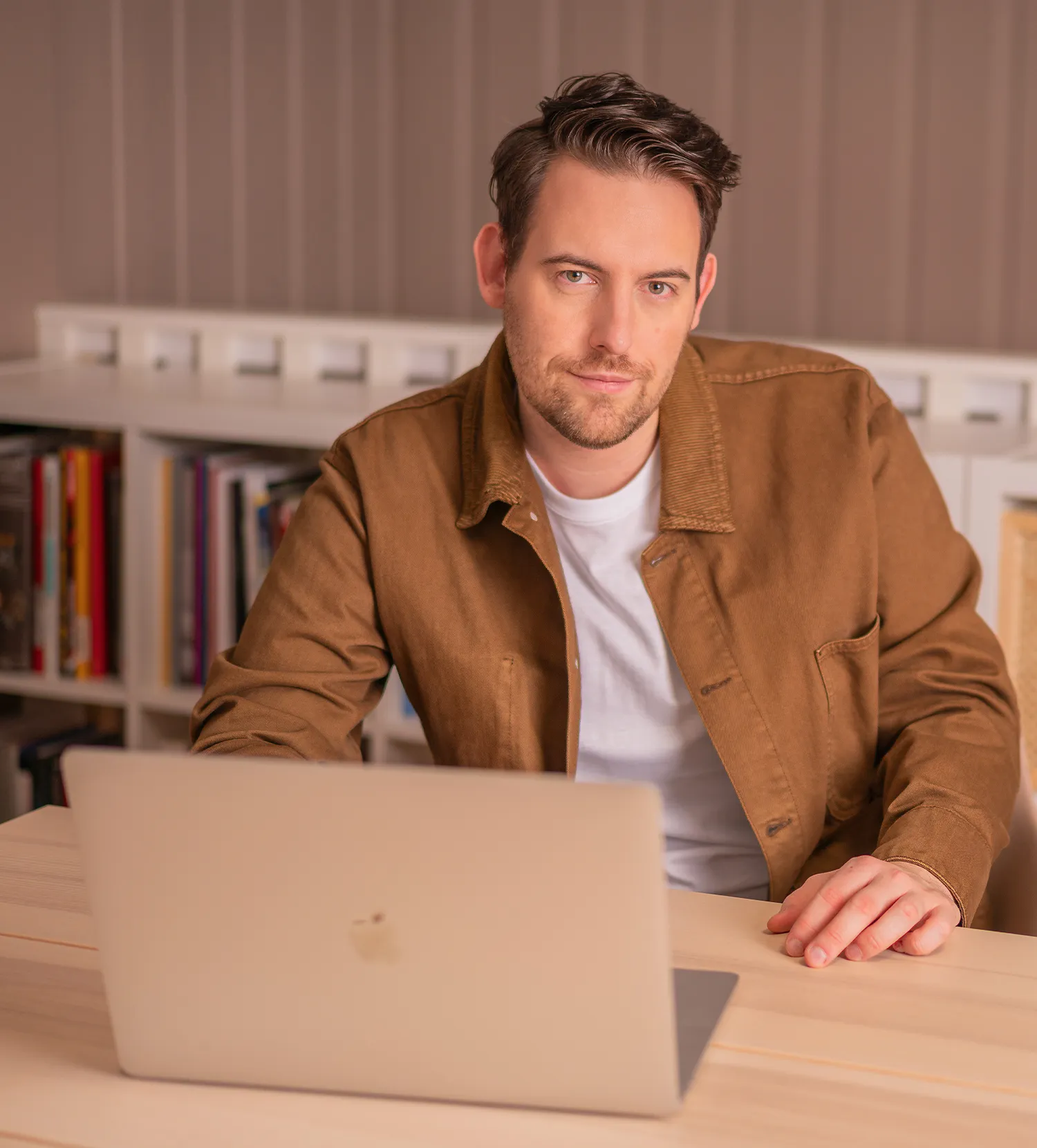 Bence Székely, digital marketing consultant, working at his desk with a laptop