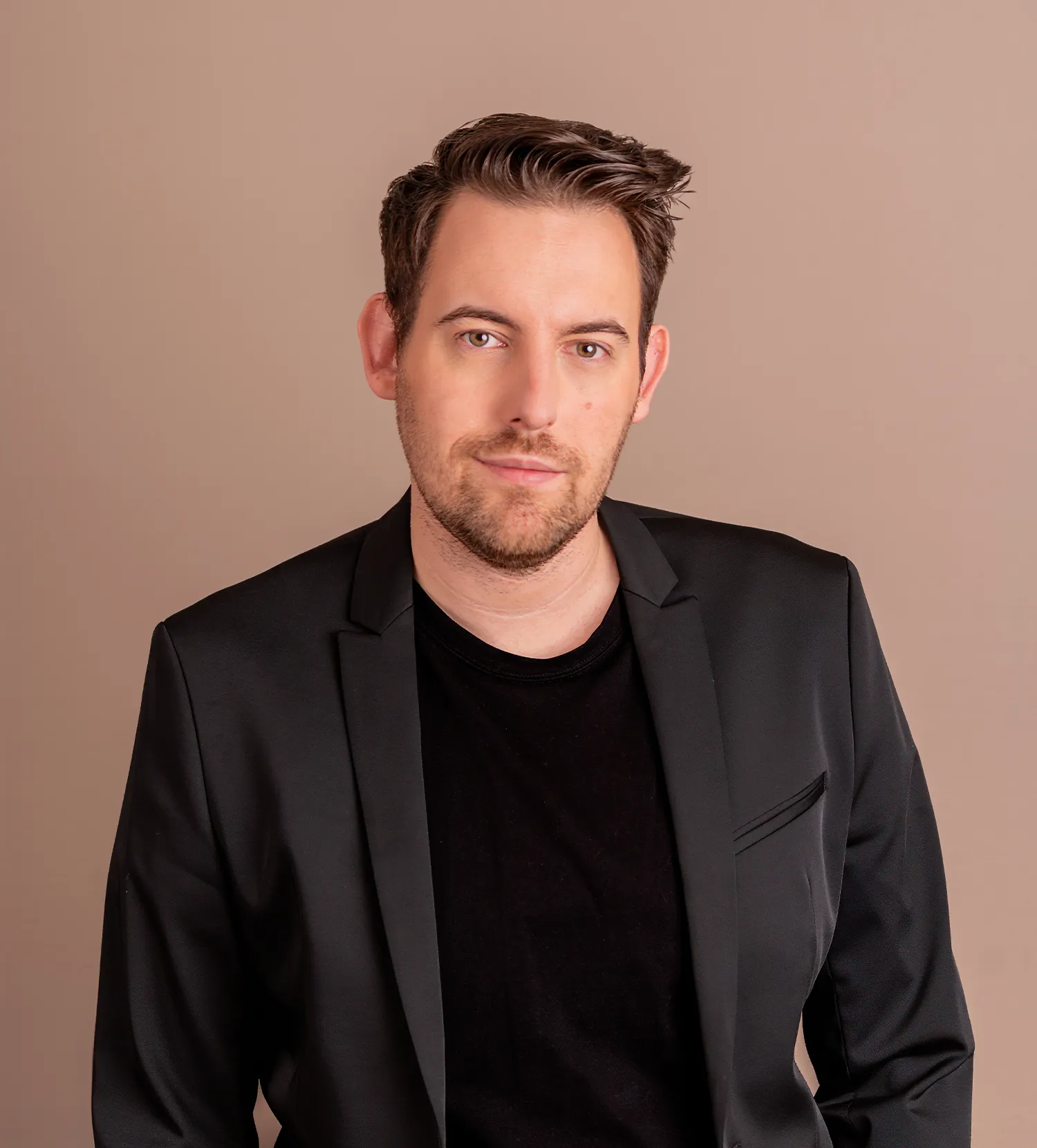 Bence Székely, digital marketing expert in a black blazer