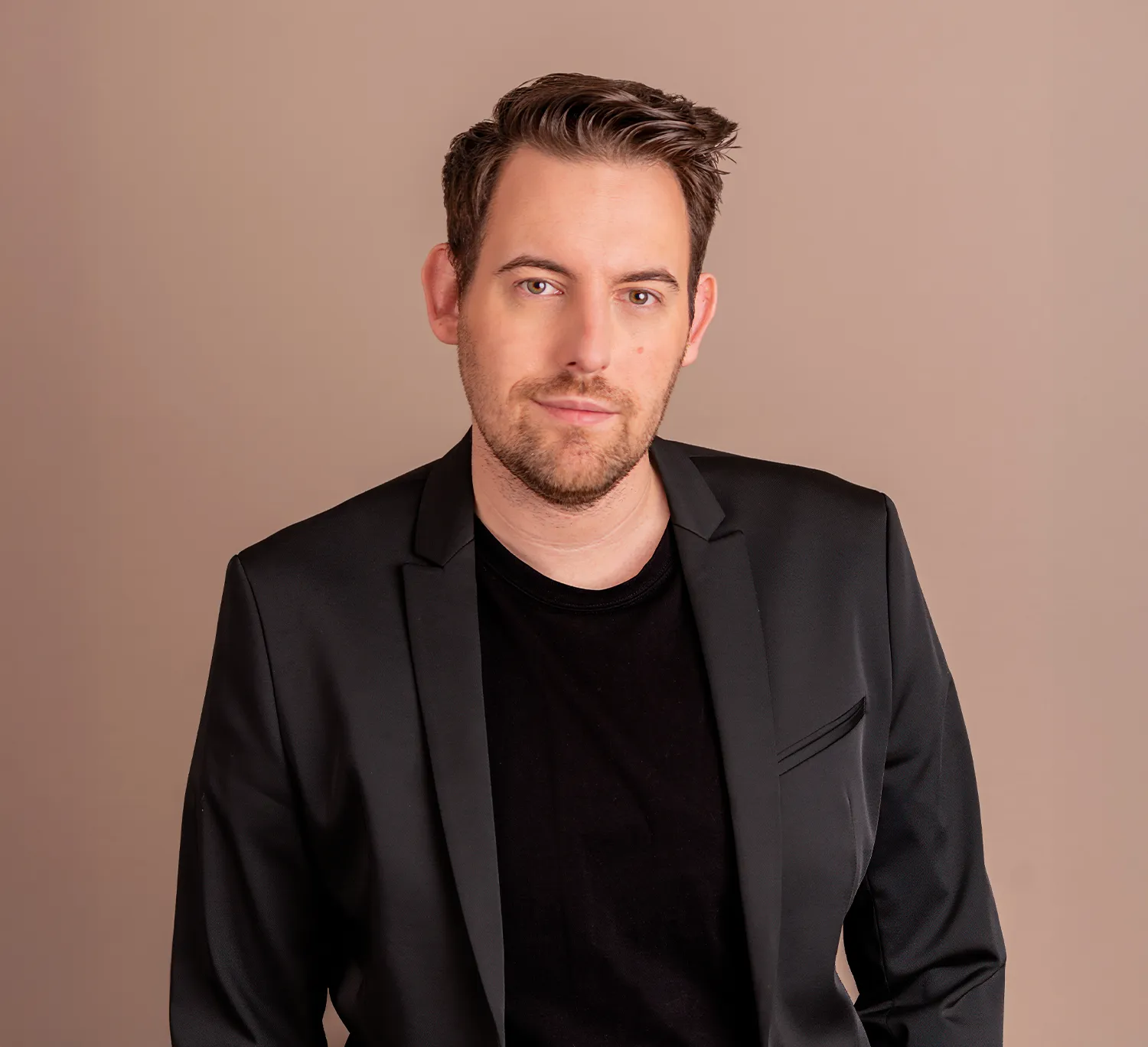 Bence Székely, marketing expert in a black blazer